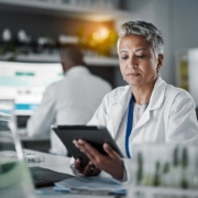 Senior,Scientist,Woman,,Tablet,And,Lab,Research,At,Desk,With