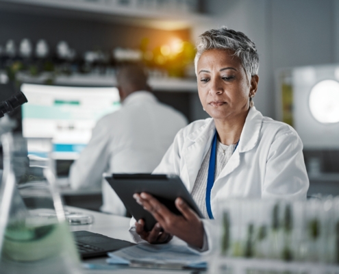 Senior,Scientist,Woman,,Tablet,And,Lab,Research,At,Desk,With