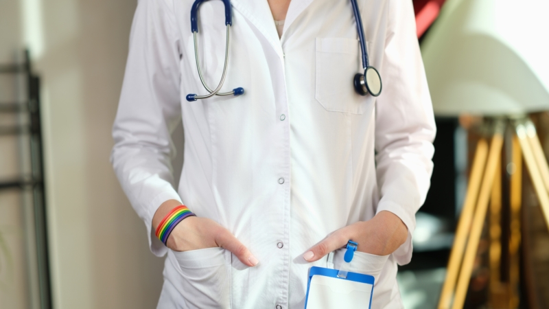 Cropped,Image,Of,Nurse,With,Rainbow,Bracelet,On,Her,Hand.