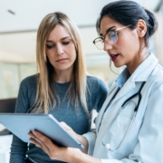 Shot,Of,Beautiful,Female,Doctor,Talking,While,Explaining,Medical,Treatment