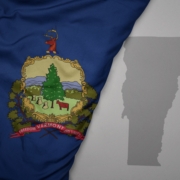 Big,Waving,National,Colorful,Flag,And,Map,Of,Vermont,State