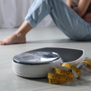 Eating,Disorder.,Sad,Woman,Sitting,Near,Scale,And,Measuring,Tape