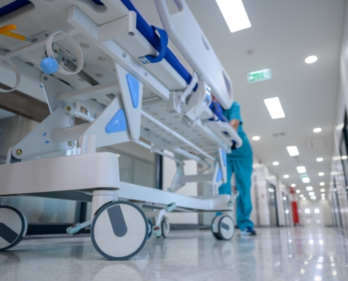 A,Hospital,Bed,Trolley,Being,Pushed,Down,A,Clean,,White