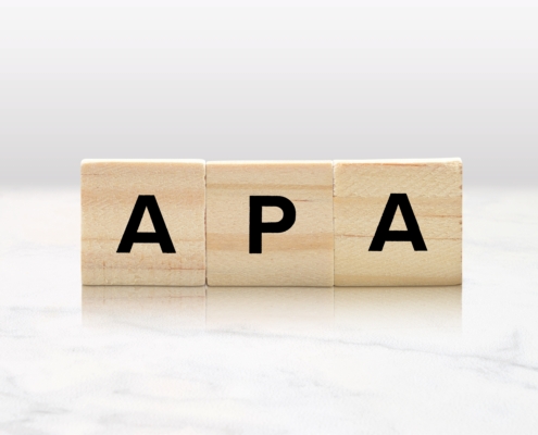 Wooden,Tiles,Spelling,Out,Apa,Atop,A,Lovely,Marble,Tabletop.