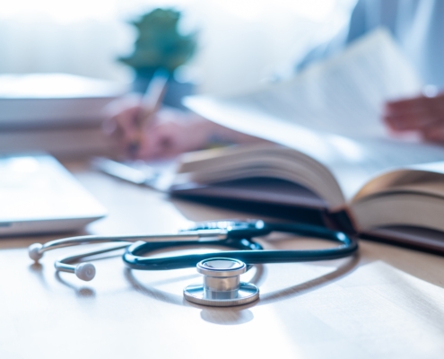 Stethoscope,,Health,And,Wellness:doctor,Reading,Latest,Medical,Journals,In,Hospital