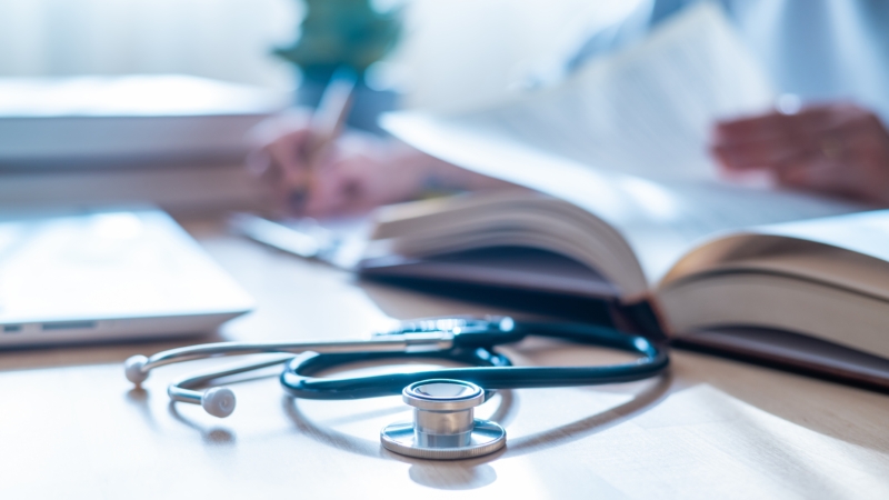 Stethoscope,,Health,And,Wellness:doctor,Reading,Latest,Medical,Journals,In,Hospital