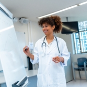 Female,Medical,Professional,Explaining,A,Concept,Drawing,On,A,Whiteboard