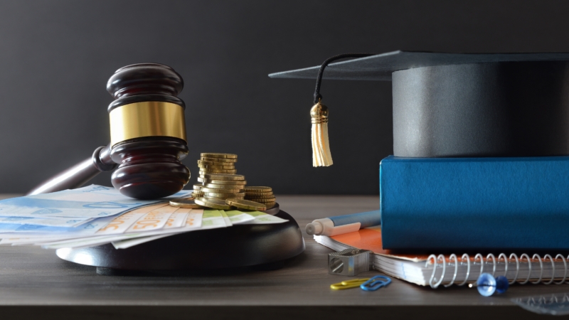 Education,Cost,Law,Concept,With,Money,On,A,Wooden,Base