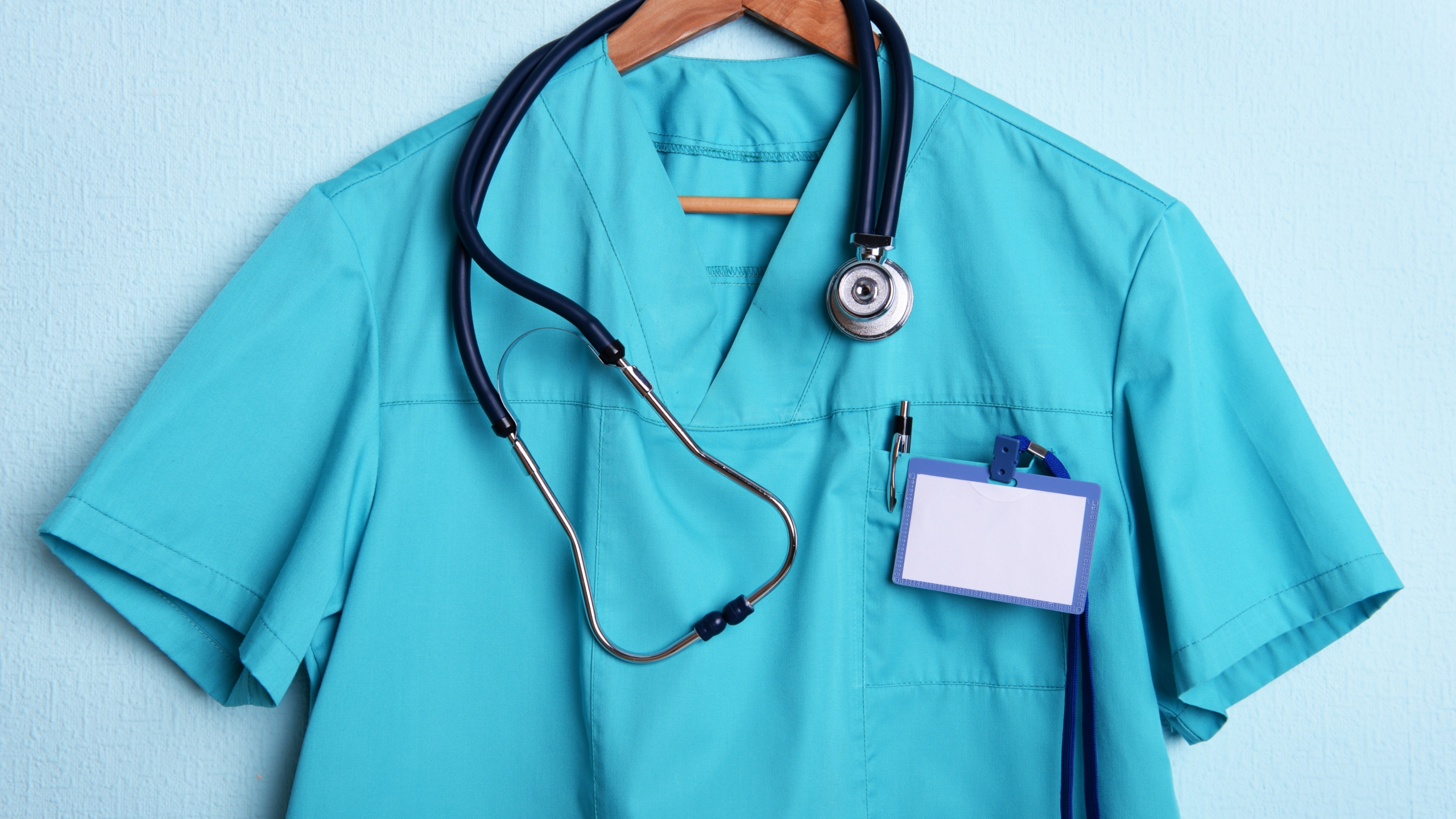 Teal,Medical,Scrub,With,Stethoscope,And,Blank,Name,Tag