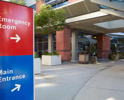 Main,Entrance,Of,Modern,Hospital,Building,With,Signs