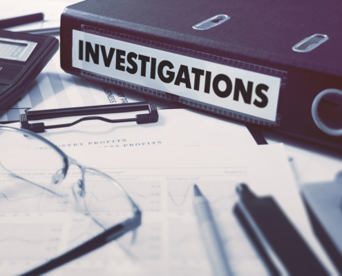 Ring,Binder,With,Inscription,Investigations,On,Background,Of,Working,Table