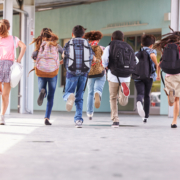 Group,Of,Elementary,School,Kids,Running,At,School,,Back,View