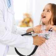 Doctor,Examining,A,Little,Girl,By,Stethoscope