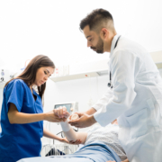 Good,Looking,Doctors,Putting,A,Bandage,On,A,Patient’s,Arm