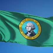Washington,(u.s.,State),Flag,Waving,Against,Clear,Blue,Sky,,Close