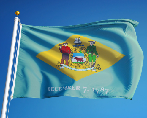 Delaware,(u.s.,State),Flag,Waving,Against,Clear,Blue,Sky,,Close