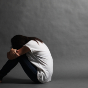 Teenager,Girl,With,Depression,Sitting,Alone,On,The,Floor,In