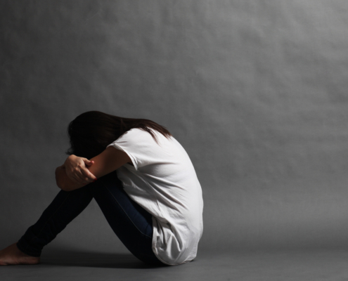 Teenager,Girl,With,Depression,Sitting,Alone,On,The,Floor,In