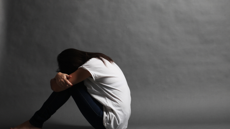 Teenager,Girl,With,Depression,Sitting,Alone,On,The,Floor,In