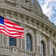 Washington,Dc,Capitol,Dome,Detail,With,Waving,American,Flag