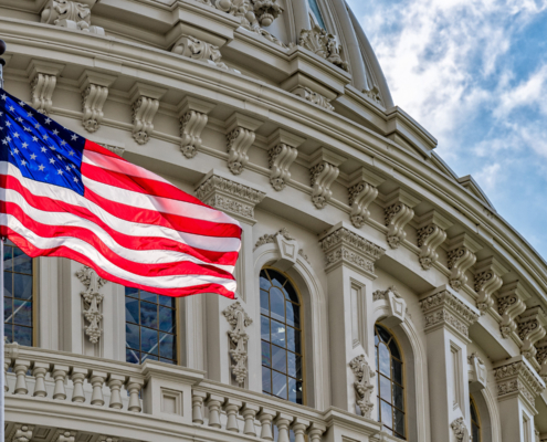 Washington,Dc,Capitol,Dome,Detail,With,Waving,American,Flag