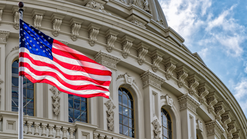 Washington,Dc,Capitol,Dome,Detail,With,Waving,American,Flag
