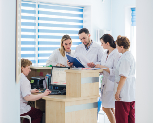 Doctor,And,Receptionist,At,Reception,In,A,Hospital