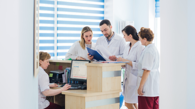 Doctor,And,Receptionist,At,Reception,In,A,Hospital
