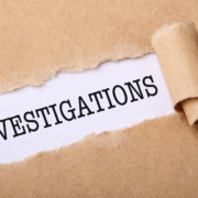 Close-up,Shot,Of,Paper,Tear,With,Text,Investigations.