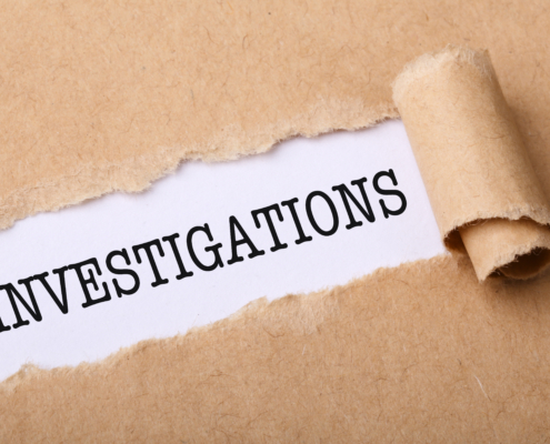 Close-up,Shot,Of,Paper,Tear,With,Text,Investigations.
