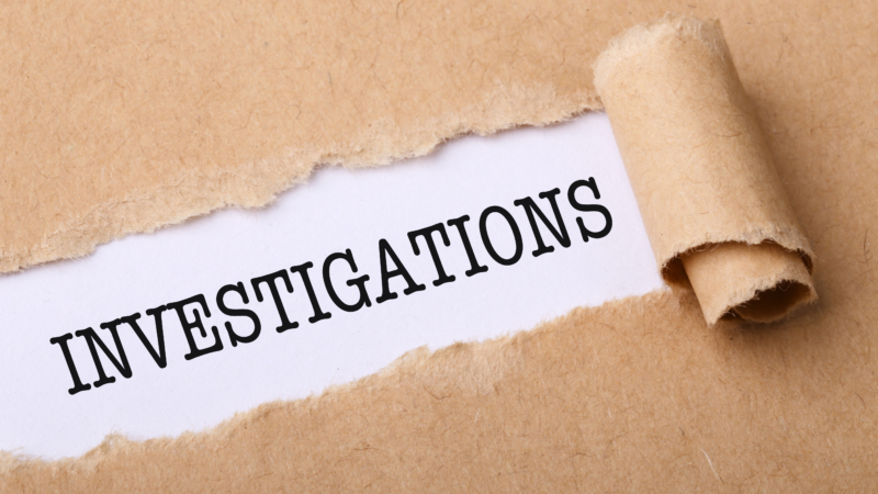 Close-up,Shot,Of,Paper,Tear,With,Text,Investigations.