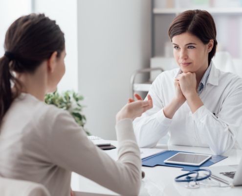 Doctor,Working,In,The,Office,And,Listening,To,The,Patient,