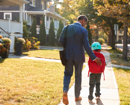 Businessman,Father,Walking,Son,On,Scooter,To,School