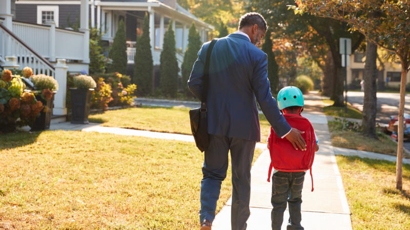 Businessman,Father,Walking,Son,On,Scooter,To,School