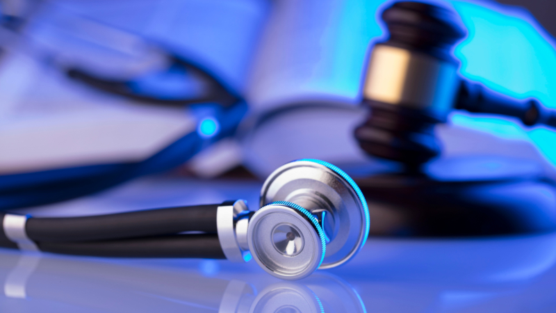 Medical,Law,Concept.,Gavel,,Stethoscope,,Blue,Light.,Place,For,Text.